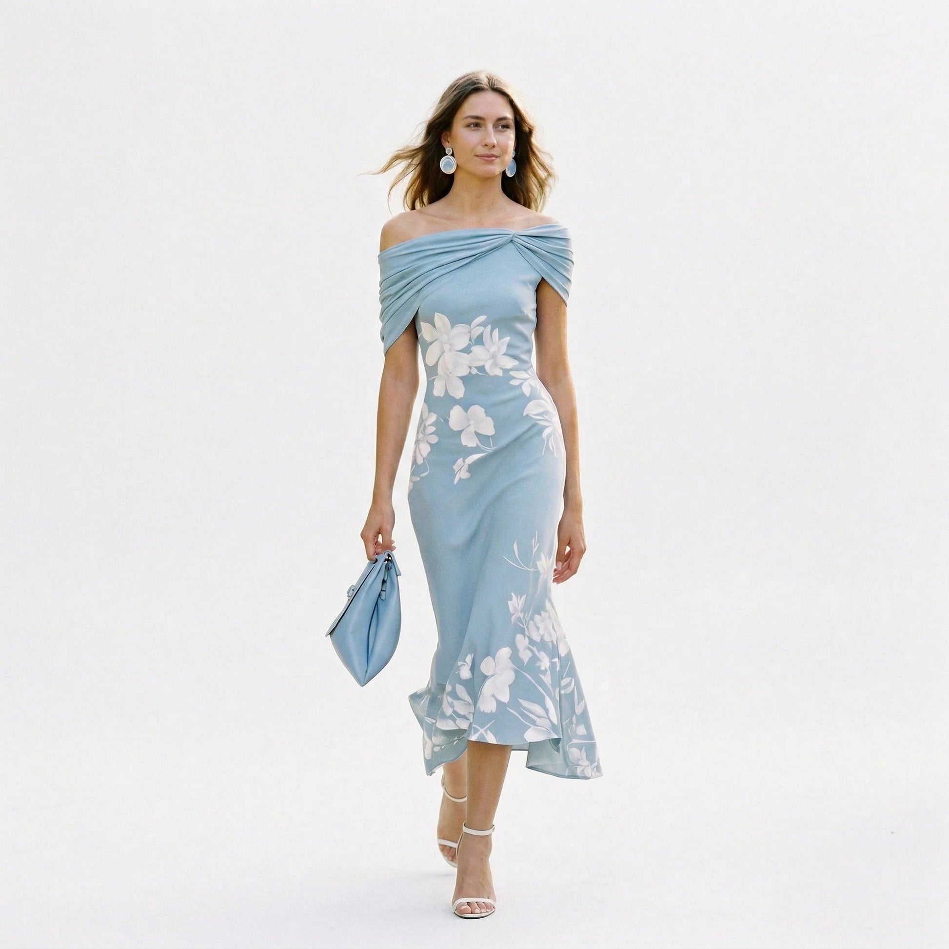 Blue - Model wearing a green floral off-shoulder midi dress with a draped neckline and asymmetrical hem, holding a matching clutch.