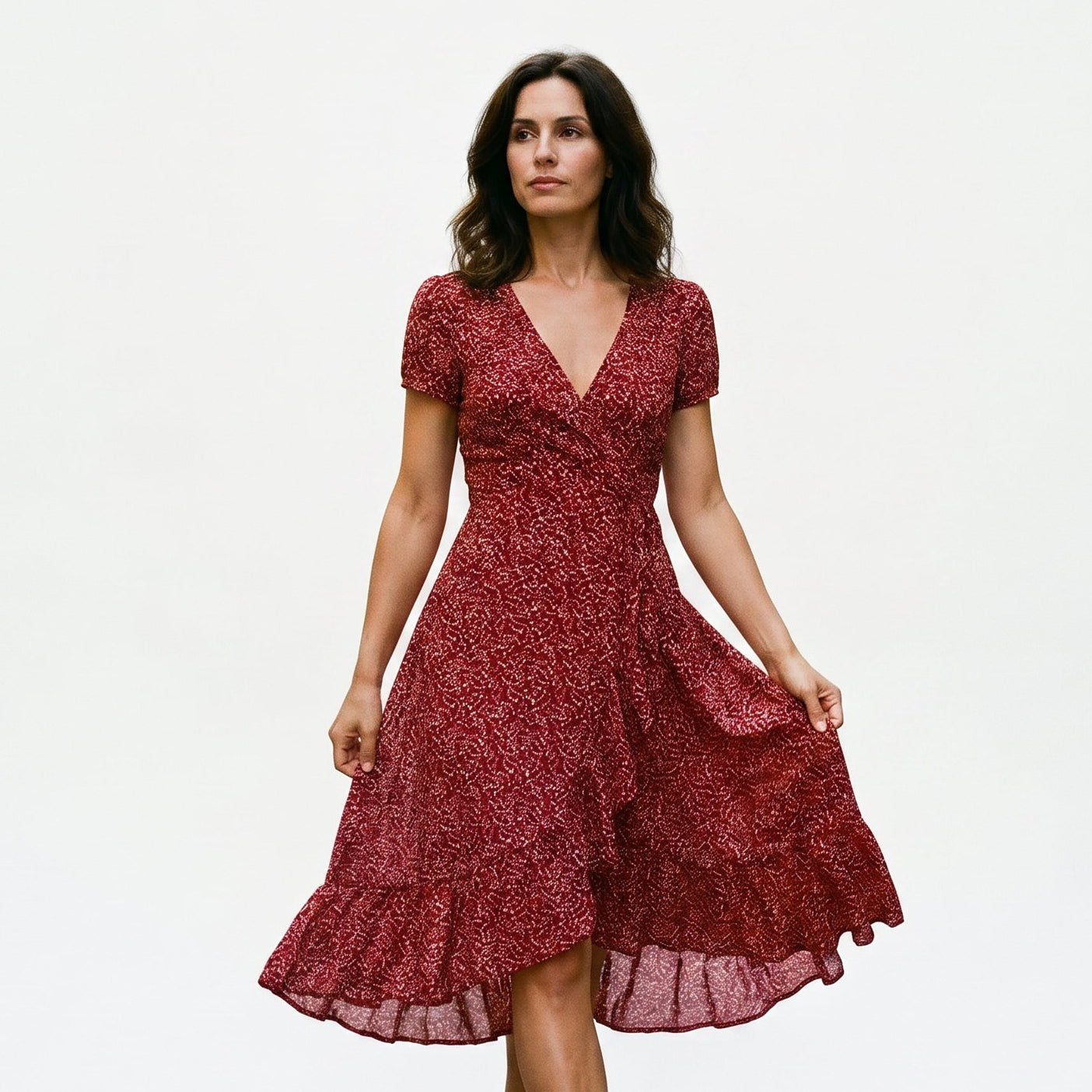 Bordeaux Red - Woman wearing a floral print midi dress featuring a V-neckline, short puff sleeves, and a flowing skirt.