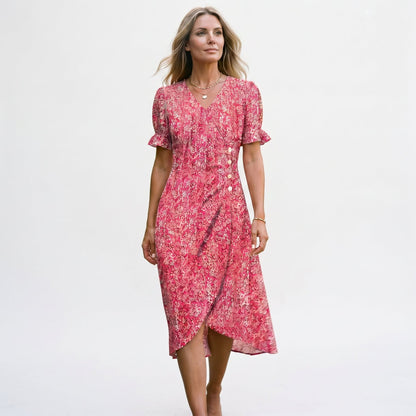Red - Model wearing a floral V-neck midi dress with short ruffled sleeves and asymmetrical button detailing on a white background
