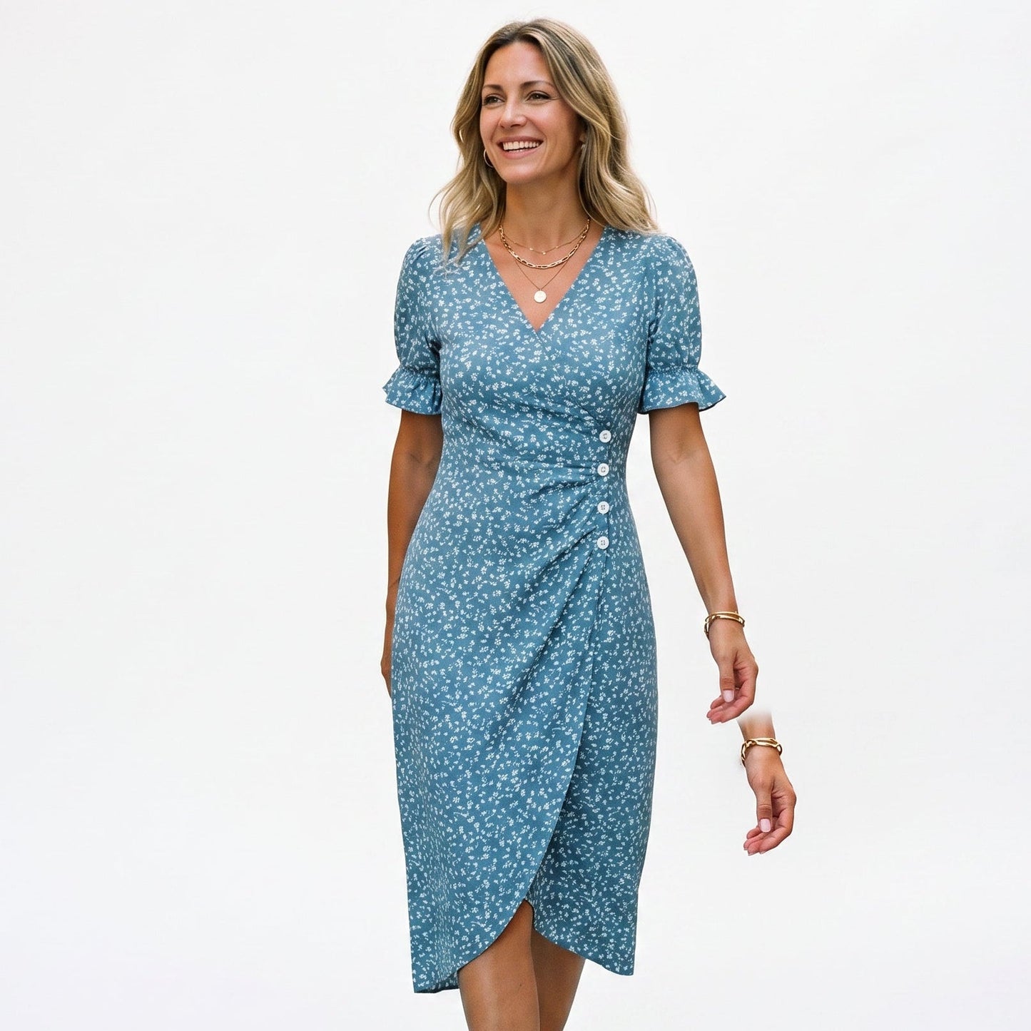 Blue - Model wearing a floral V-neck midi dress with short ruffled sleeves and asymmetrical button detailing on a white background
