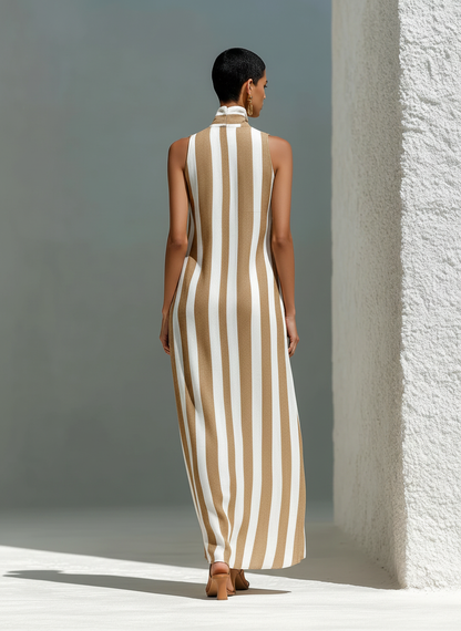 Camel And White - Model walking outdoors wearing a sleeveless, wide-leg striped jumpsuit with a stand collar and deep v-neckline.