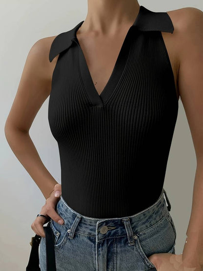 Woman in white ribbed halter top and denim shorts