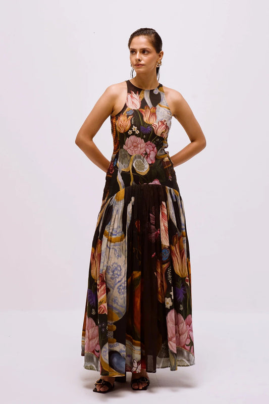 Woman in floral print chiffon maxi dress