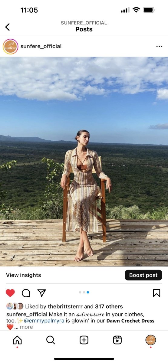 Woman in multicolored ribbed knit maxi dress with long sleeves and collared neckline
