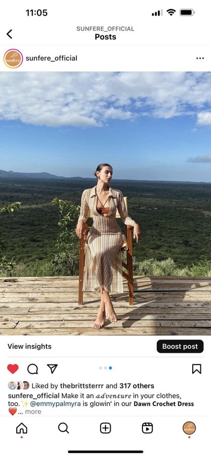 Woman in multicolored ribbed knit maxi dress with long sleeves and collared neckline
