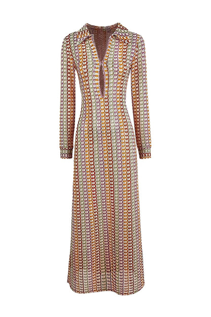 Woman in multicolored ribbed knit maxi dress with long sleeves and collared neckline