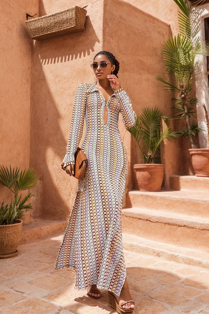 Woman in multicolored ribbed knit maxi dress with long sleeves and collared neckline