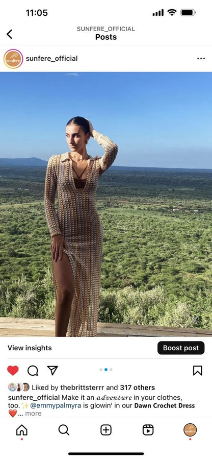 Woman in multicolored ribbed knit maxi dress with long sleeves and collared neckline