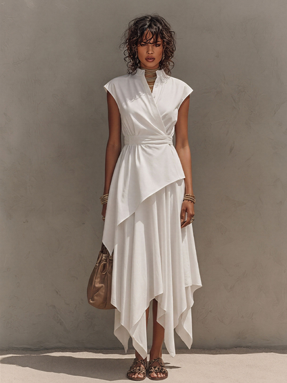 Off-White - Woman wearing a sleeveless, collared midi dress with a wrap bodice and asymmetrical handkerchief hem, styled with sandals and a handbag.