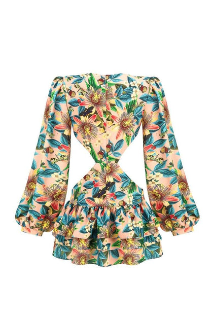 Woman wearing floral mini dress with cutout waist
