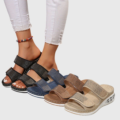 Black - Women's double strap platform sandals featuring rhinestone embellishments, adjustable hook-and-loop closures, and a thick shock-absorbing sole.