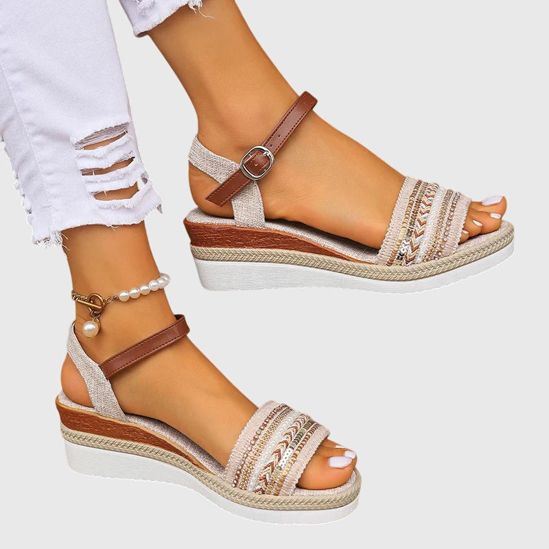 White/Brown - Women's open-toe wedge sandals featuring a breathable canvas upper, intricate beaded embroidery across the front strap, an adjustable faux-leather ankle strap, and a layered shock-absorbing sole.