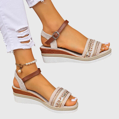 White/Brown - Women's open-toe wedge sandals featuring a breathable canvas upper, intricate beaded embroidery across the front strap, an adjustable faux-leather ankle strap, and a layered shock-absorbing sole.