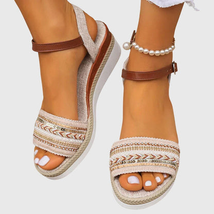 White/Brown - Women's open-toe wedge sandals featuring a breathable canvas upper, intricate beaded embroidery across the front strap, an adjustable faux-leather ankle strap, and a layered shock-absorbing sole.