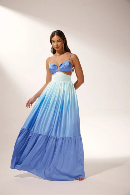 Woman wearing blue ombre satin maxi dress with cutout waist