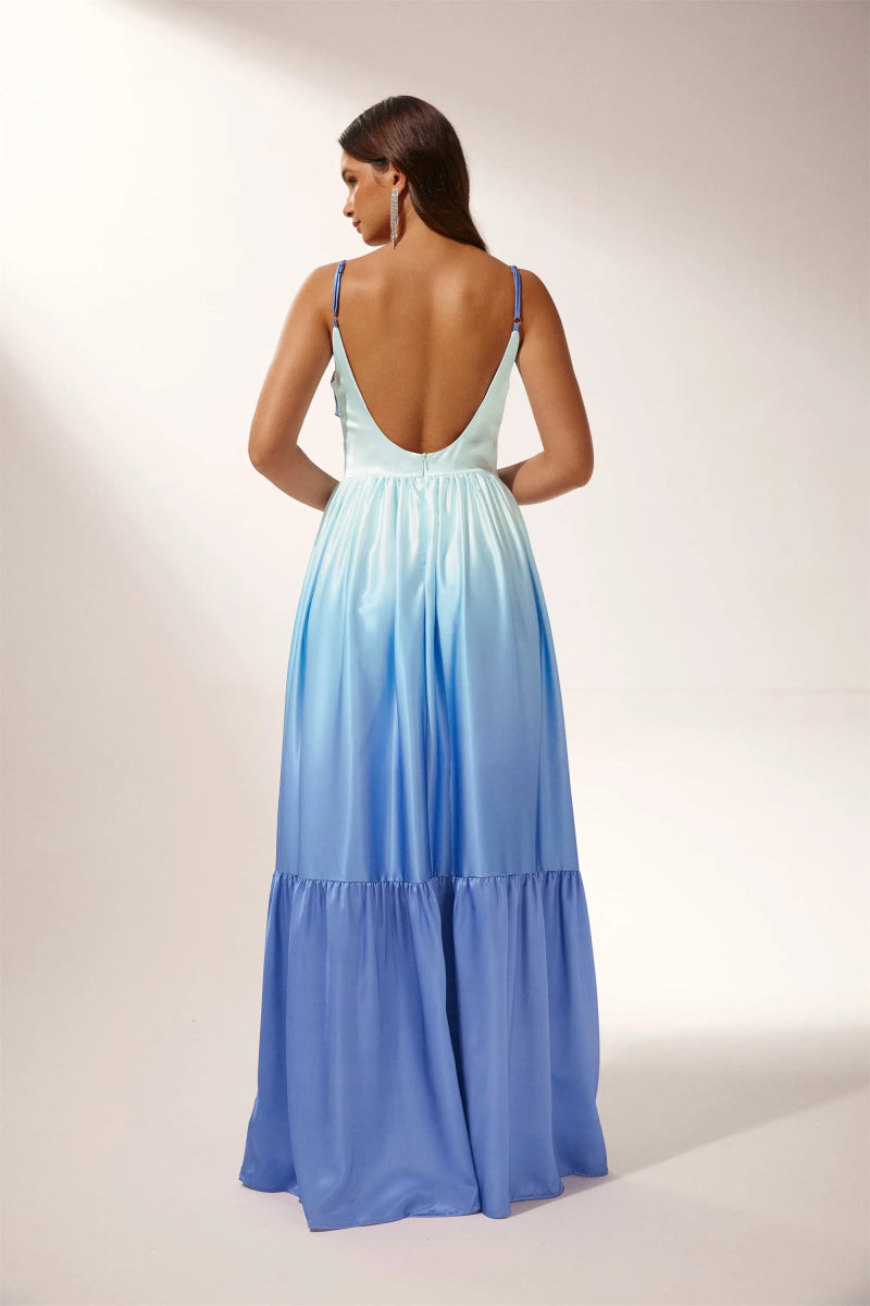 Woman wearing blue ombre satin maxi dress with cutout waist
