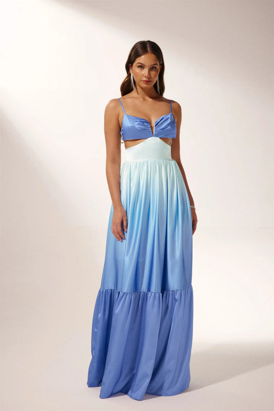 Woman wearing blue ombre satin maxi dress with cutout waist