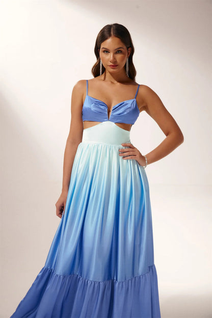 Woman wearing blue ombre satin maxi dress with cutout waist
