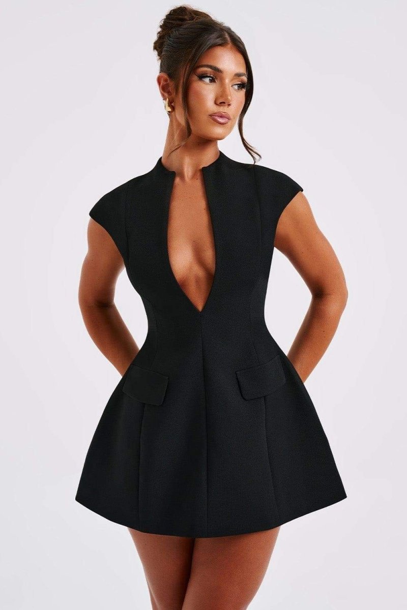 Woman in black crepe mini dress with plunging neckline