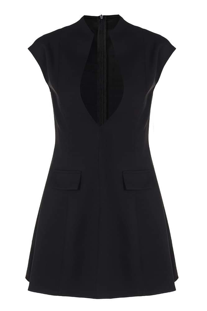 Woman in black crepe mini dress with plunging neckline