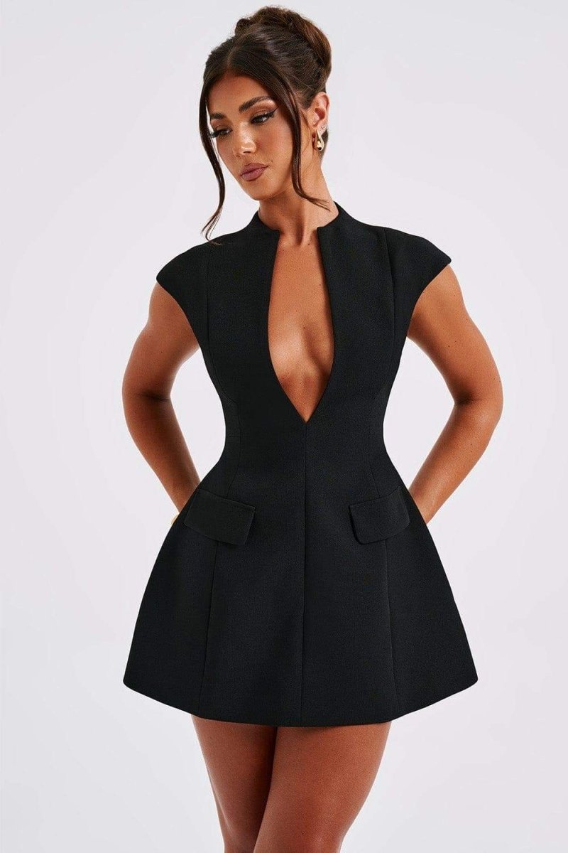 Woman in black crepe mini dress with plunging neckline