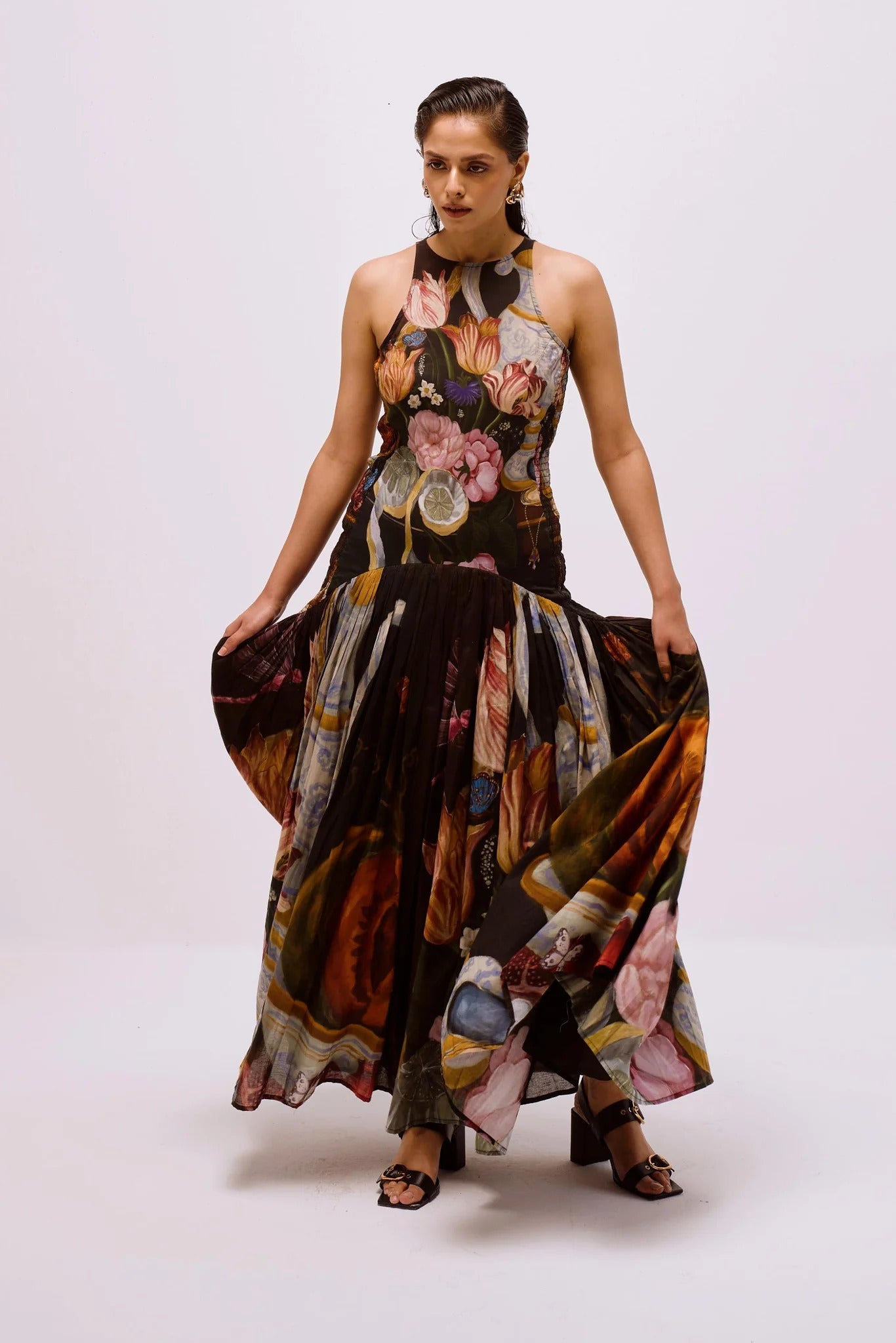 Woman in floral print chiffon maxi dress
