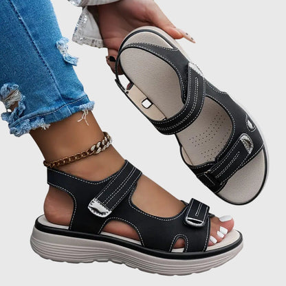 Black - Textured faux-leather platform sandals featuring adjustable hook-and-loop straps, contrast stitching, and a thick cushioned sole.