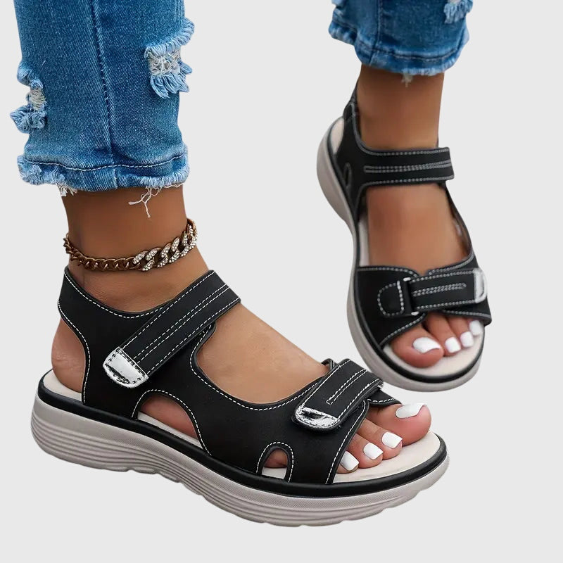 Black - Textured faux-leather platform sandals featuring adjustable hook-and-loop straps, contrast stitching, and a thick cushioned sole.