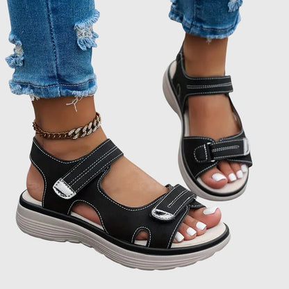 Black - Textured faux-leather platform sandals featuring adjustable hook-and-loop straps, contrast stitching, and a thick cushioned sole.