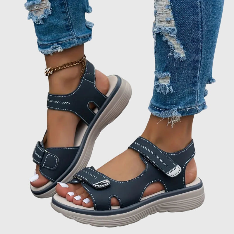 Blue - Textured faux-leather platform sandals featuring adjustable hook-and-loop straps, contrast stitching, and a thick cushioned sole.