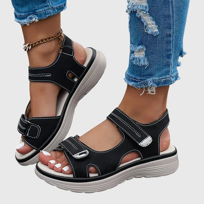 Black - Textured faux-leather platform sandals featuring adjustable hook-and-loop straps, contrast stitching, and a thick cushioned sole.