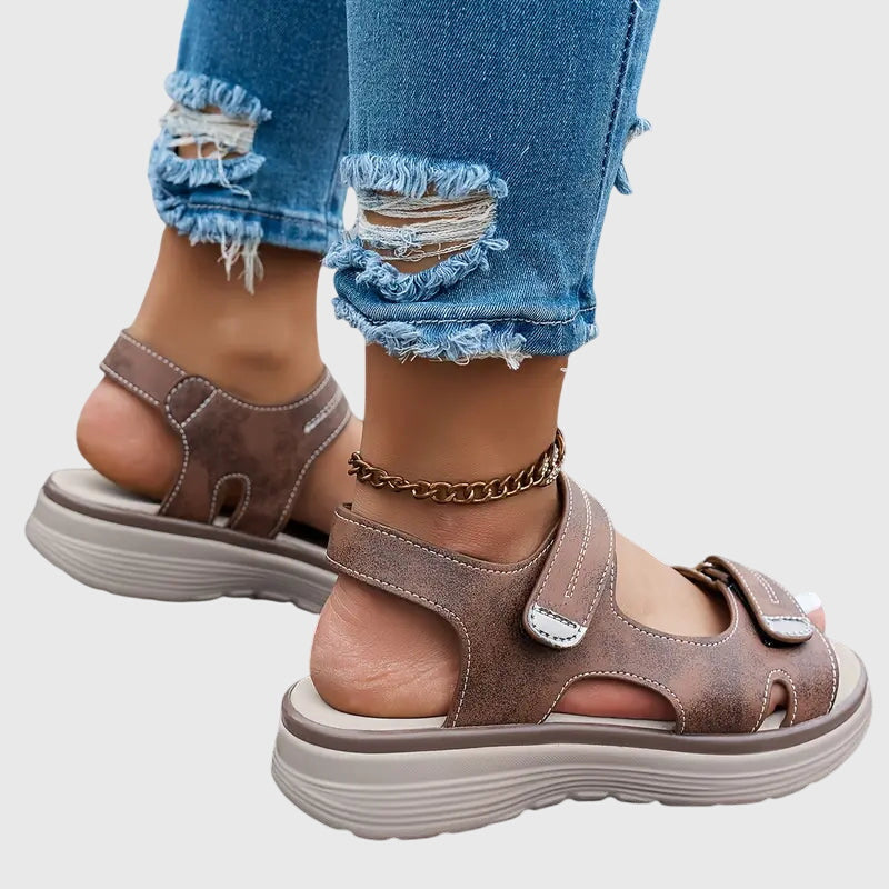 Black - Textured faux-leather platform sandals featuring adjustable hook-and-loop straps, contrast stitching, and a thick cushioned sole.