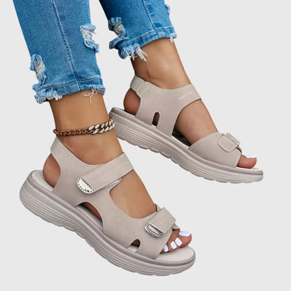 Black - Textured faux-leather platform sandals featuring adjustable hook-and-loop straps, contrast stitching, and a thick cushioned sole.