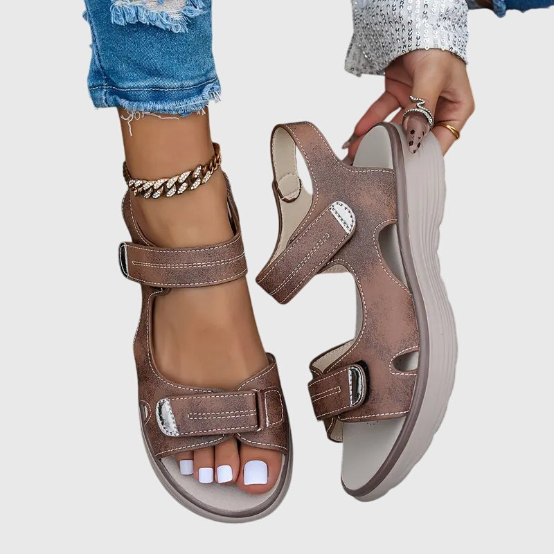 Black - Textured faux-leather platform sandals featuring adjustable hook-and-loop straps, contrast stitching, and a thick cushioned sole.