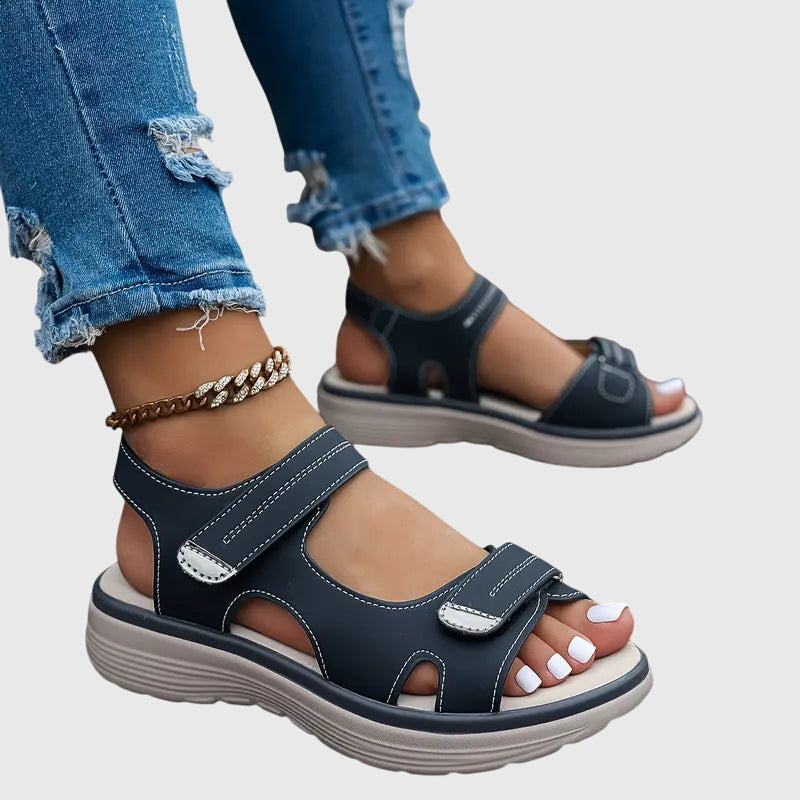 Black - Textured faux-leather platform sandals featuring adjustable hook-and-loop straps, contrast stitching, and a thick cushioned sole.