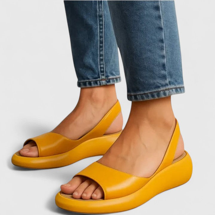 Yellow - Women's smooth faux-leather platform sandals featuring a wide upper strap, open toe, and an integrated slingback strap on a thick cushioned sole.