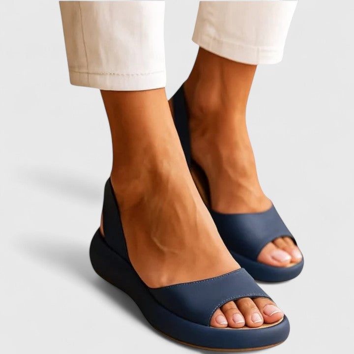Blue - Women's smooth faux-leather platform sandals featuring a wide upper strap, open toe, and an integrated slingback strap on a thick cushioned sole.