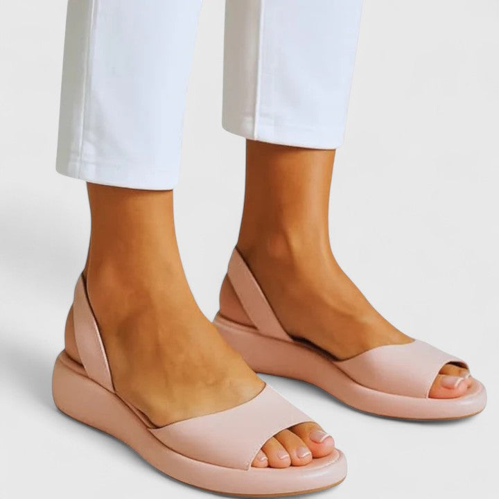 Pink - Women's smooth faux-leather platform sandals featuring a wide upper strap, open toe, and an integrated slingback strap on a thick cushioned sole.