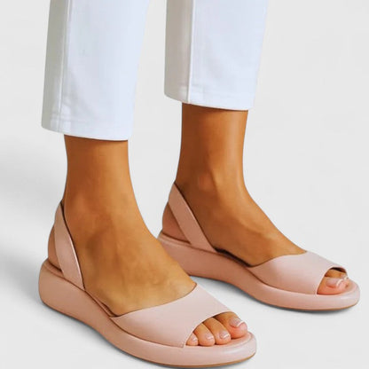Pink - Women's smooth faux-leather platform sandals featuring a wide upper strap, open toe, and an integrated slingback strap on a thick cushioned sole.