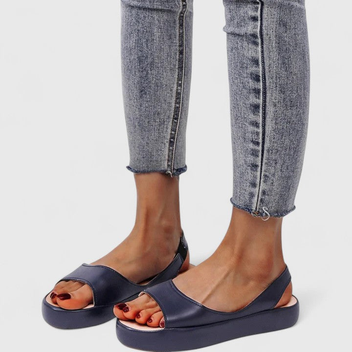 Pink - Women's smooth faux-leather platform sandals featuring a wide upper strap, open toe, and an integrated slingback strap on a thick cushioned sole.