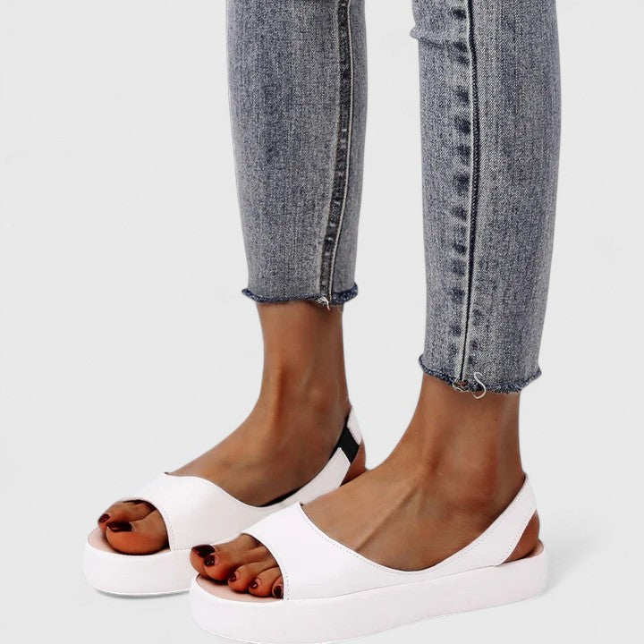 Pink - Women's smooth faux-leather platform sandals featuring a wide upper strap, open toe, and an integrated slingback strap on a thick cushioned sole.