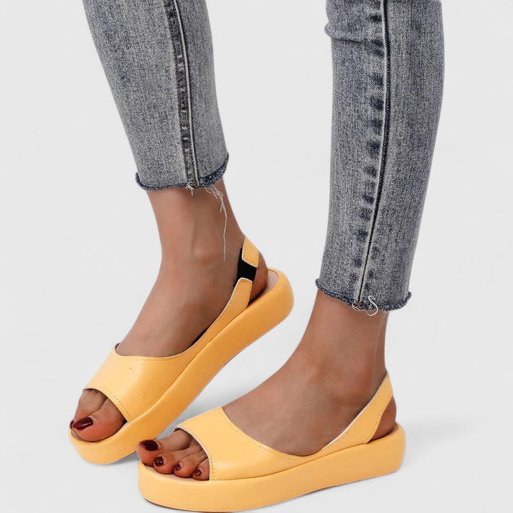 Pink - Women's smooth faux-leather platform sandals featuring a wide upper strap, open toe, and an integrated slingback strap on a thick cushioned sole.