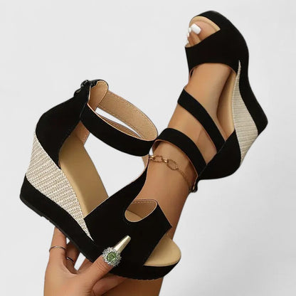 Black - Women's open-toe wedge sandals featuring an asymmetric faux-suede upper, woven side panel detail, and a back heel zipper.