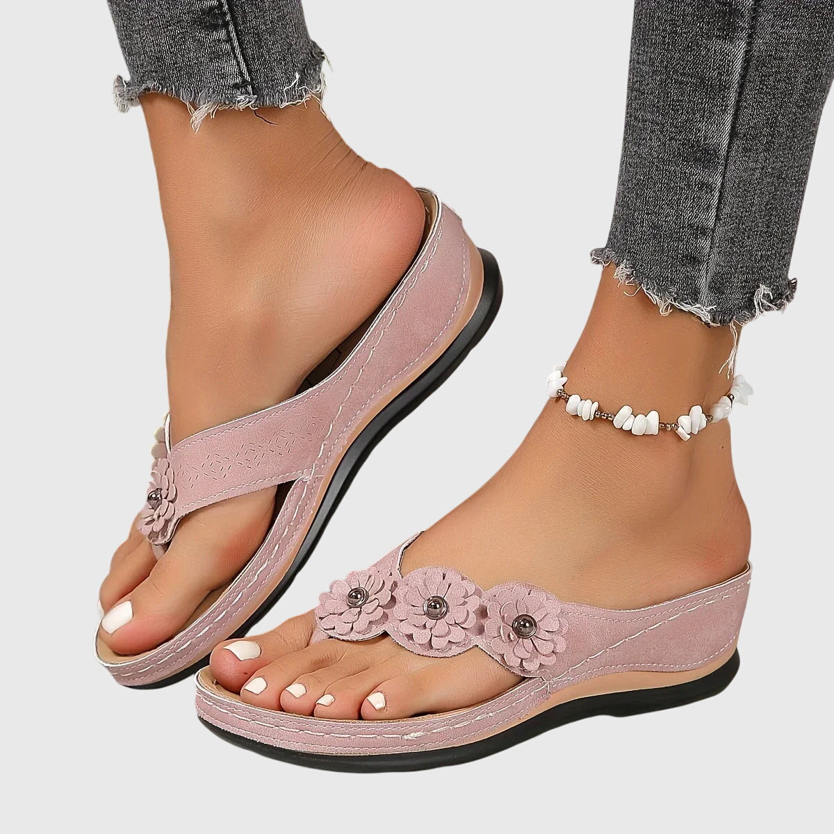 Pink - Faux-suede slip-on wedge sandals featuring three floral appliques across the instep, contrast stitching details, and a contoured comfort footbed.