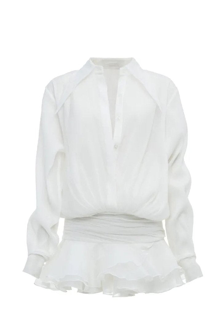 Woman in white sheer chiffon shirt dress with ruffles