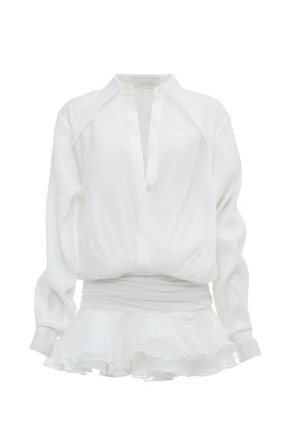 Woman in white sheer chiffon shirt dress with ruffles