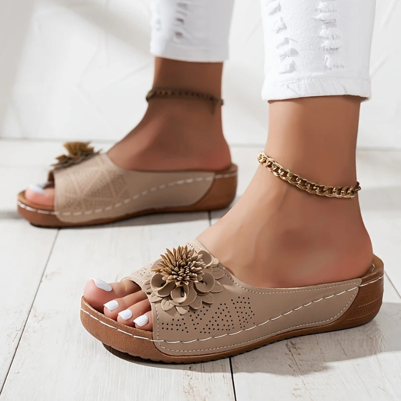 Khaki - Women's slip-on wedge sandals featuring a perforated upper with a 3D floral applique and contrast stitching.