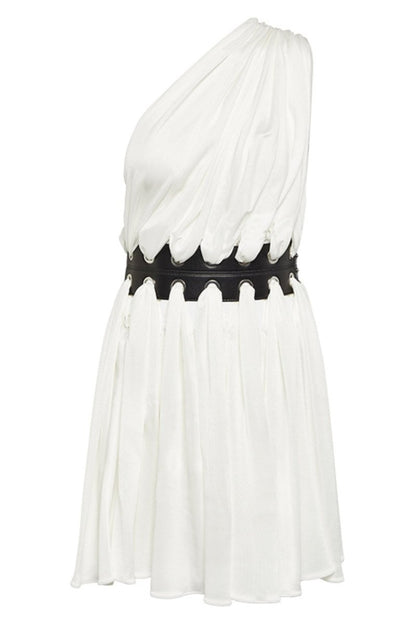 Woman in white one-shoulder mini dress with cutout waist