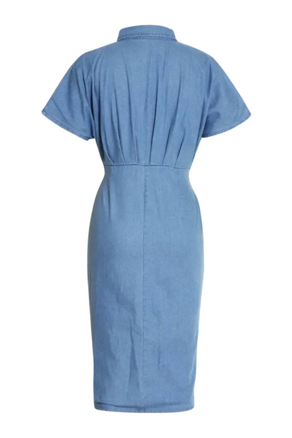 Woman in light blue denim shirt dress with tie waist.