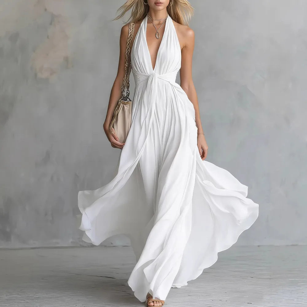 White - A woman wearing a dusty lavender chiffon halter maxi dress with a plunging V-neckline, pleated bodice, and a flowing floor-length skirt.